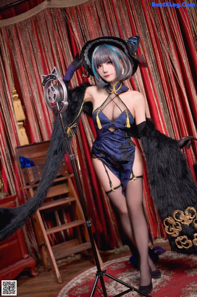 A woman in a black cat costume posing for a picture.
