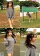 a woman in a gray sweatshirt and shorts standing on a tennis court