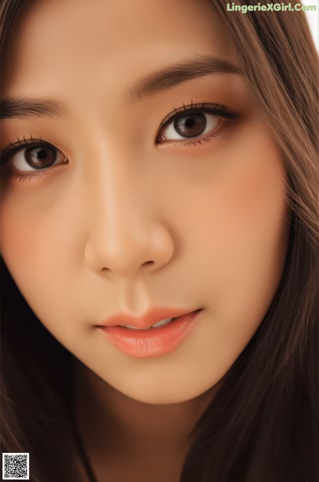 a close up of a woman's face with long brown hair